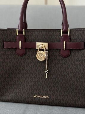 Michael Kors Brown Monogram Satchel with Burgundy Trim with matching wallet